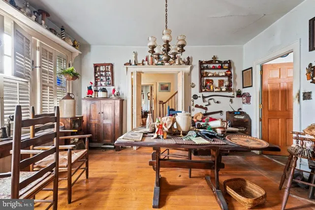 a room with furniture a chandelier and a window