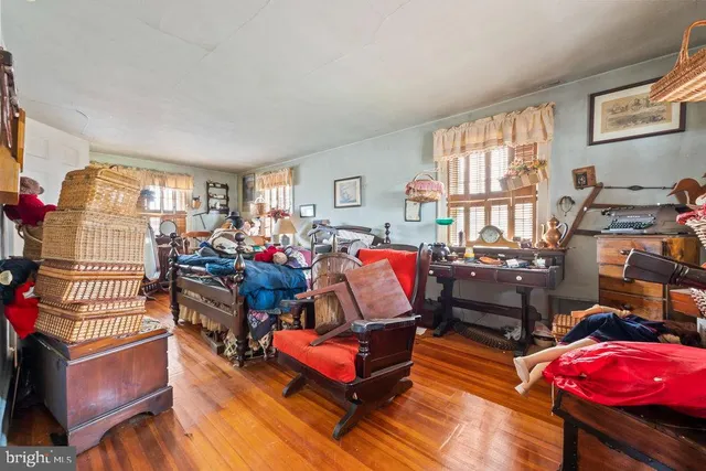 a bed room with furniture and a window