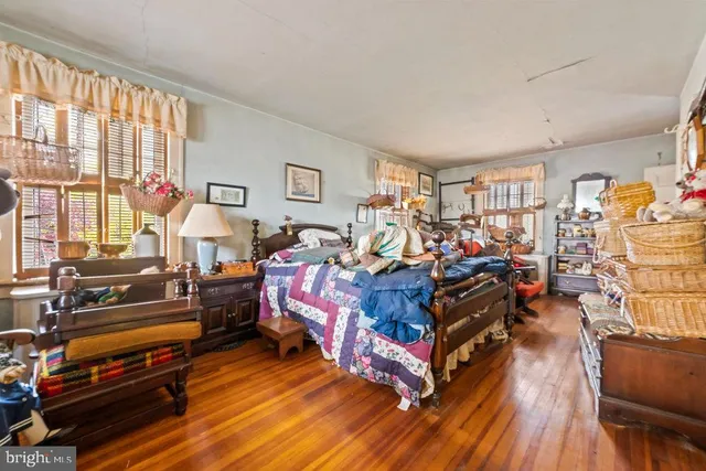 a bed room with furniture and a window