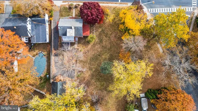a backyard of a house with large trees