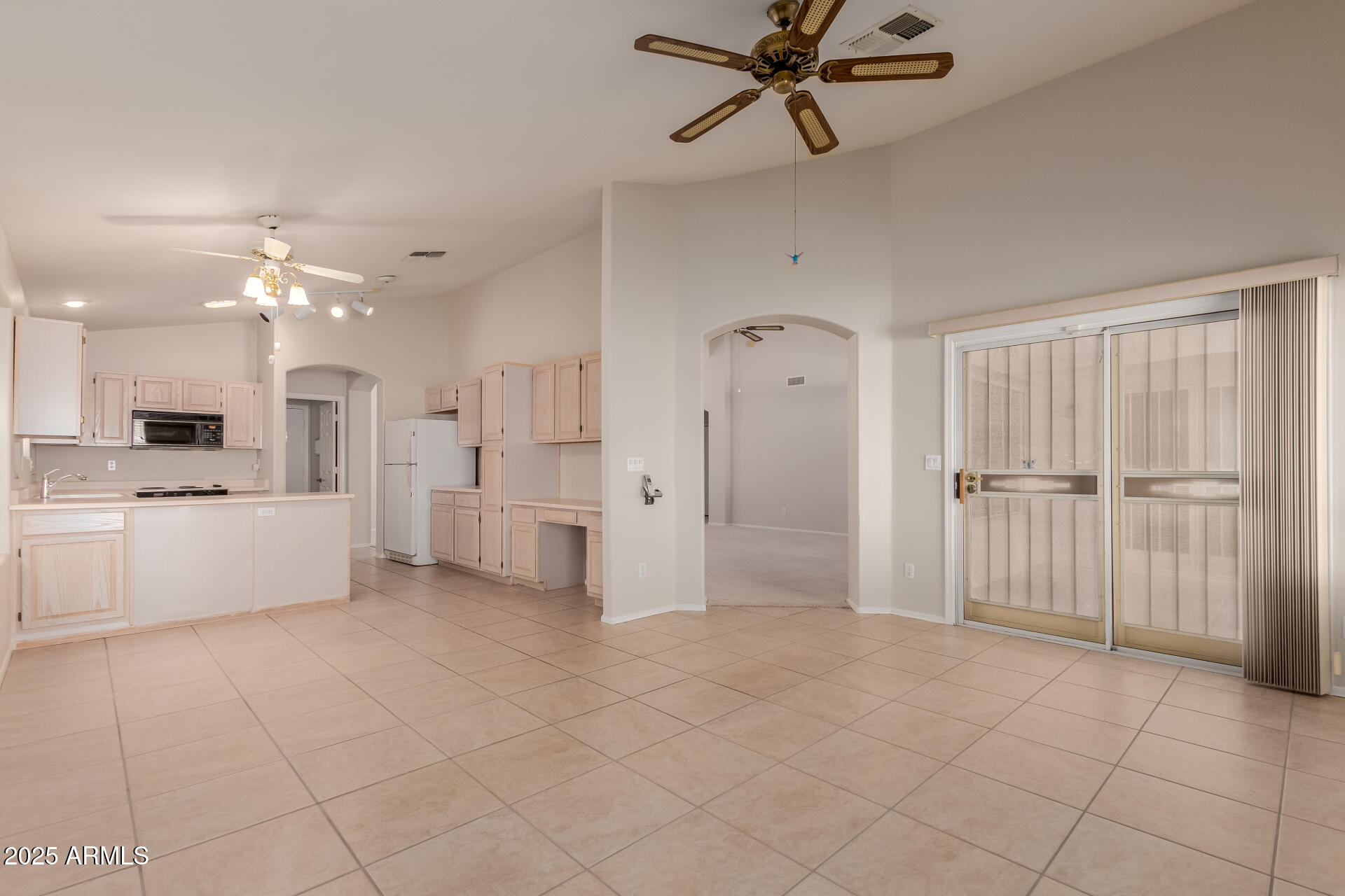 14588 West Bison Path Surprise, AZ 85374 - Photo 13 of 42 a view of a kitchen with a sink and stainless steel appliances