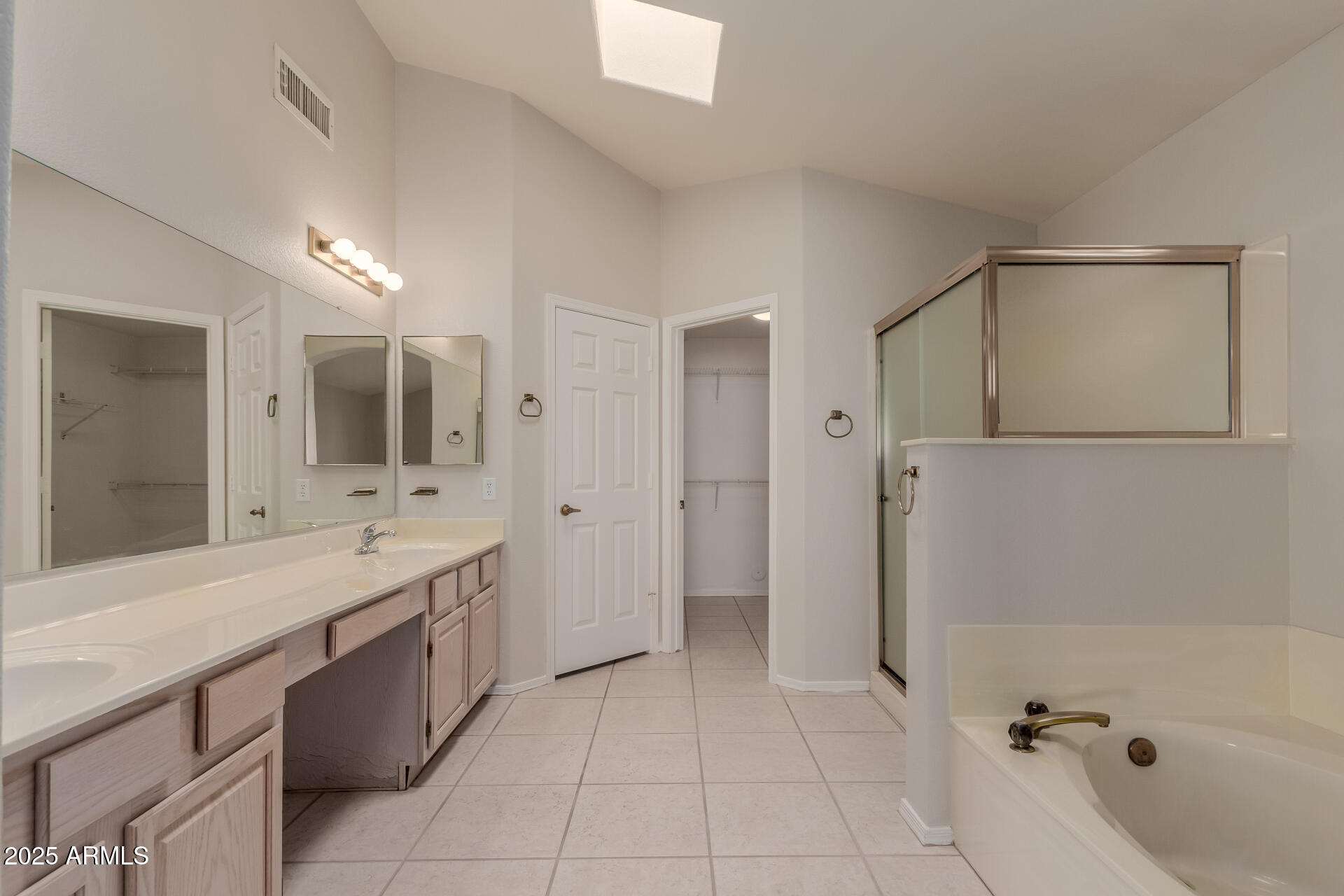 14588 West Bison Path Surprise, AZ 85374 - Photo 22 of 42 a large bathroom with a tub sink shower and mirror