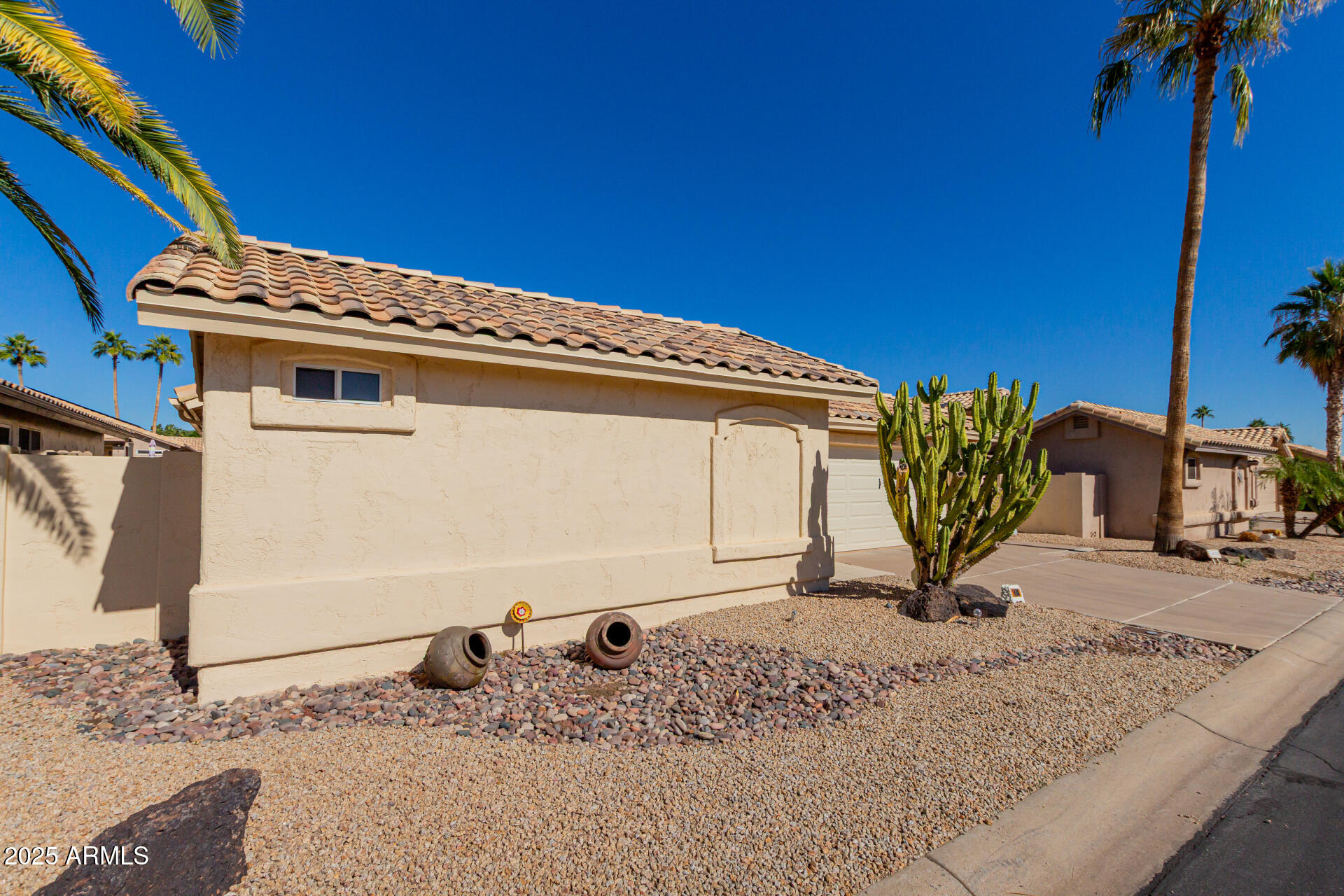 14588 West Bison Path Surprise, AZ 85374 - Photo 3 of 42 a front view of a house with a yard