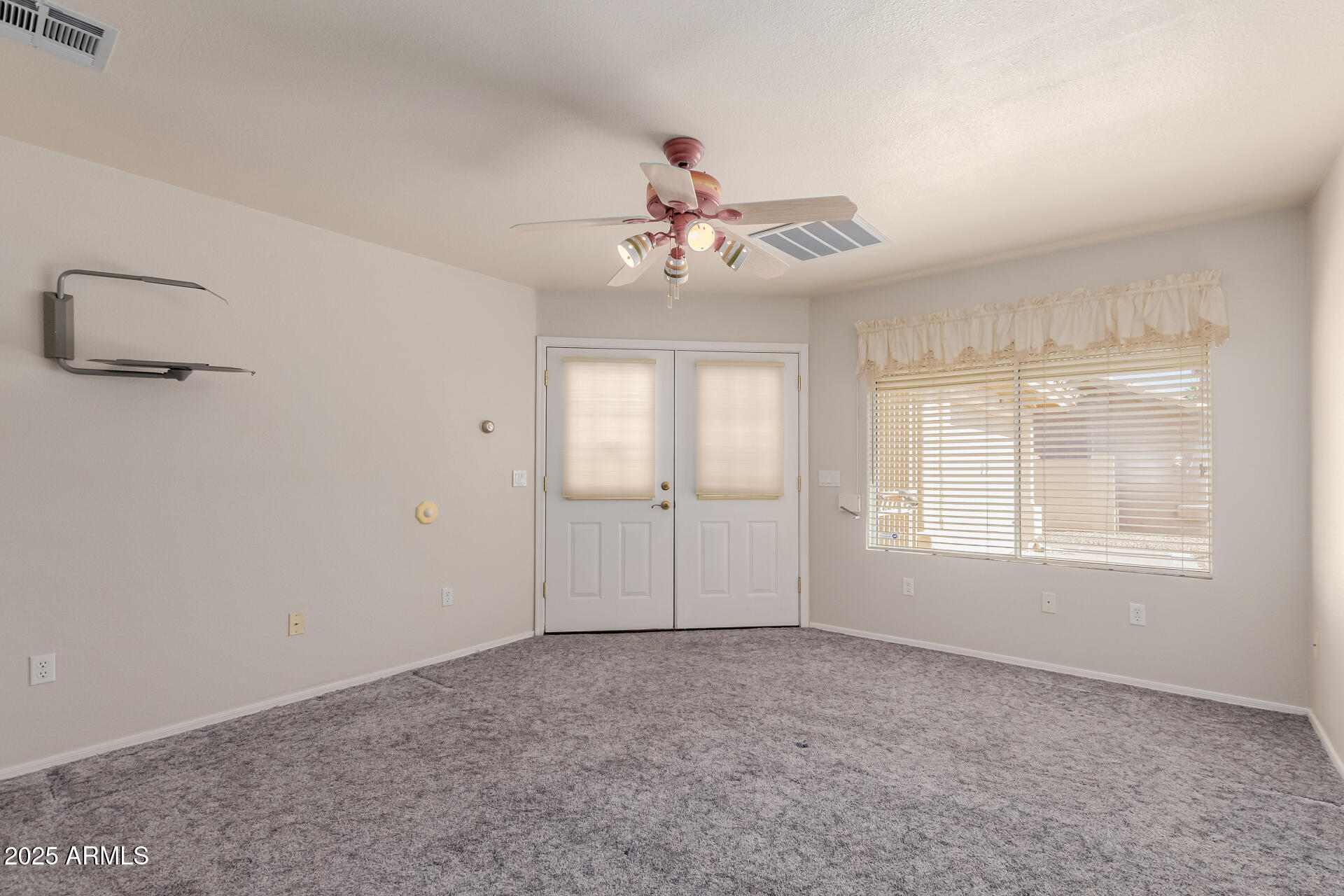14588 West Bison Path Surprise, AZ 85374 - Photo 31 of 42 a view of an empty room with a window