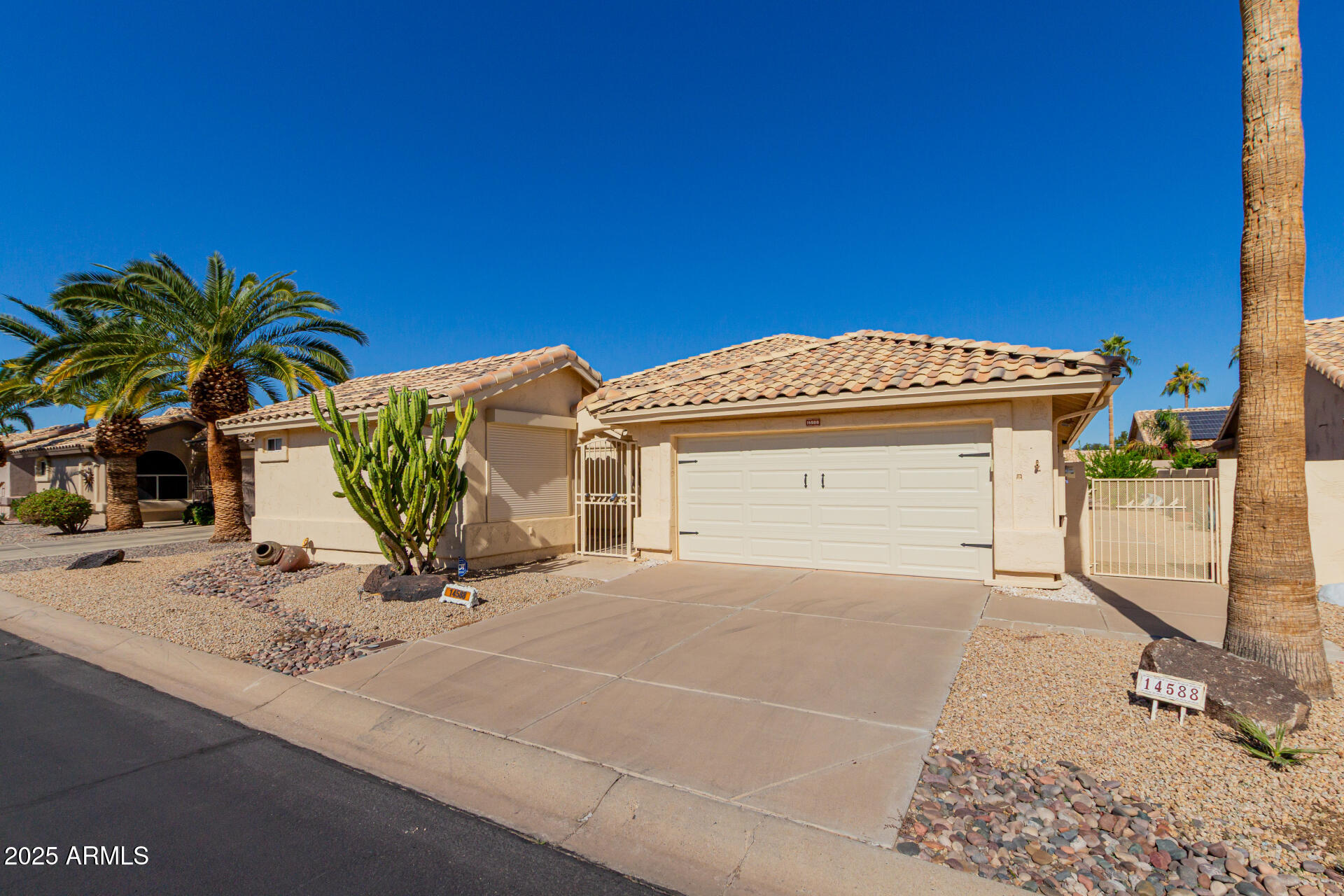 14588 West Bison Path Surprise, AZ 85374 - Photo 4 of 42 a view of a house with a street