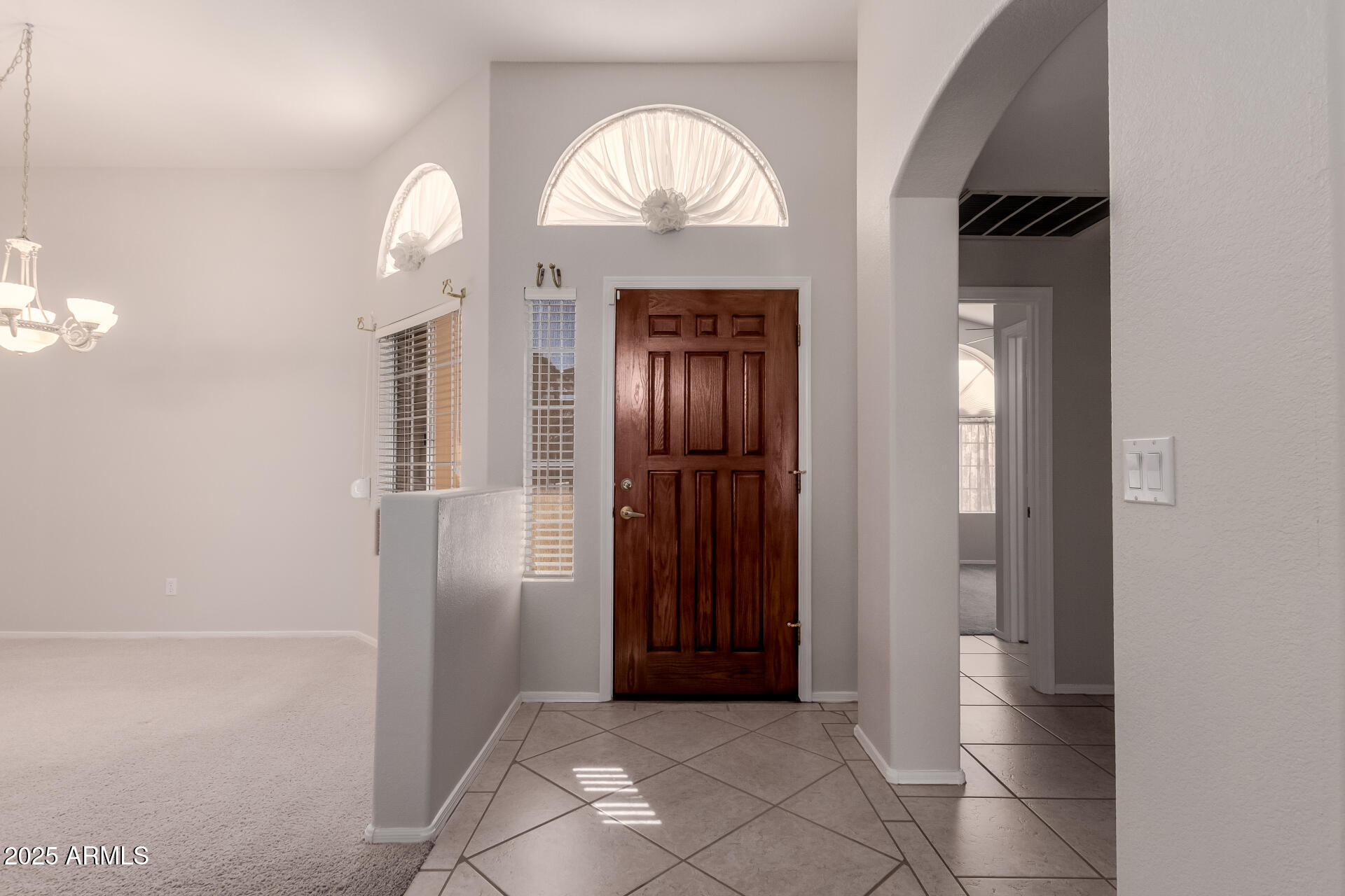 14588 West Bison Path Surprise, AZ 85374 - Photo 7 of 42 an empty room with wooden floor and a bathroom