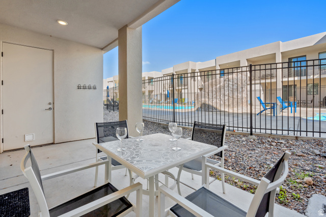 1122 South 1790th Street West, Unit 2 St. George, UT 84770 - Photo 5 of 37 Covered patio with concrete flooring, recessed lighting, and a white exterior door