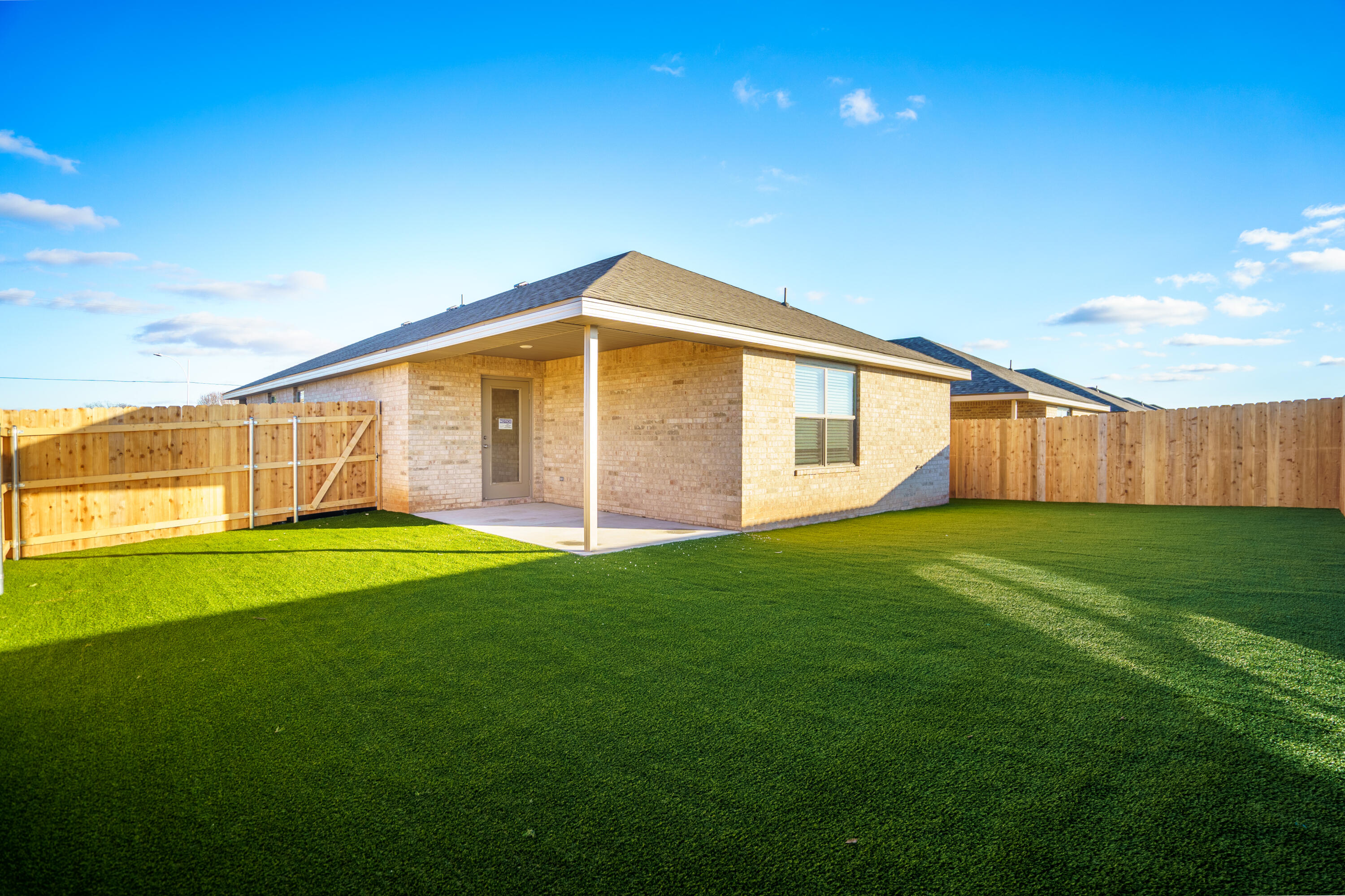 320 East 76th Street Lubbock, TX 79404 - Photo 14 of 14 a view of a backyard with large trees