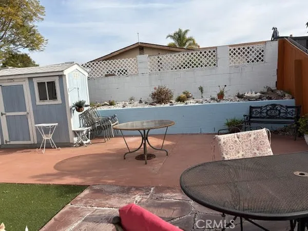 a view of a chairs and table in the patio