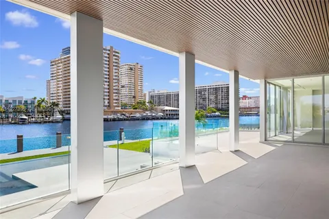 a view of a lake with a couple of cars parked in a balcony