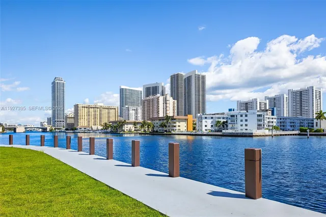 a front view of a house with plants