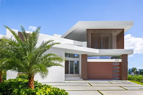 a front view of a house with a garage