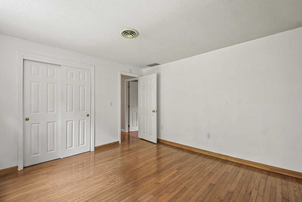 573 Main Street Dunstable, MA 01827 - Photo 23 of 42 a view of an empty room with wooden floor