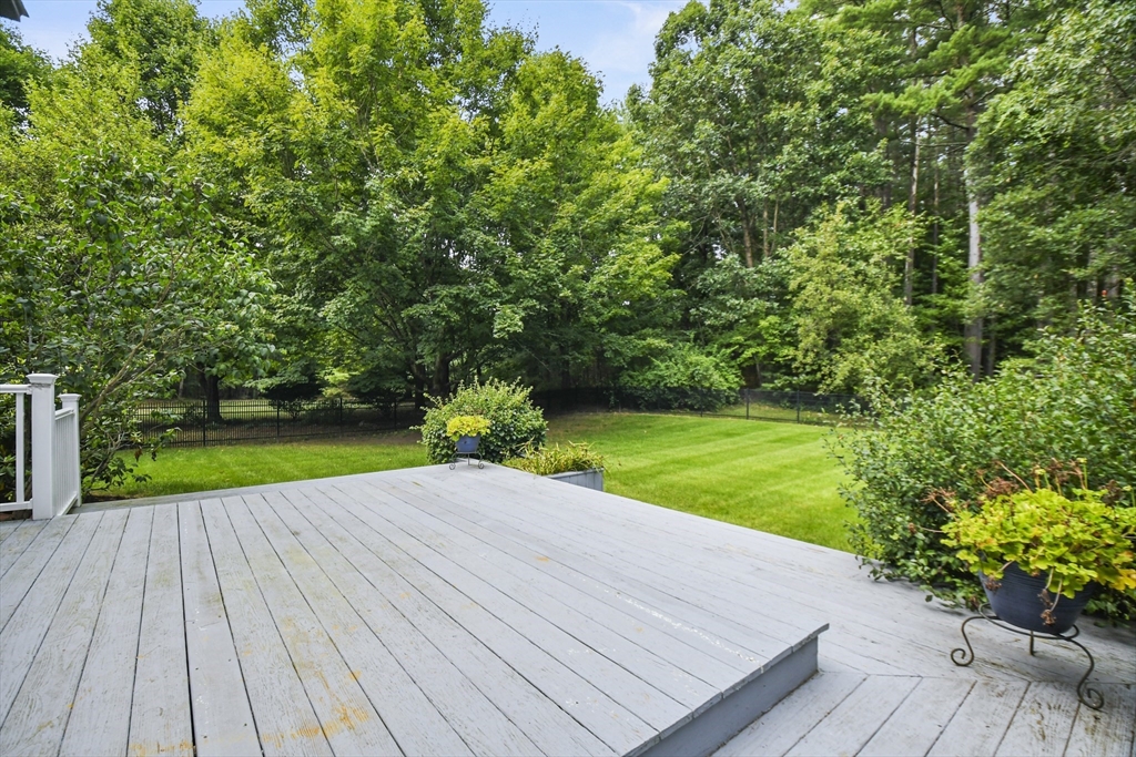 573 Main Street Dunstable, MA 01827 - Photo 31 of 42 a view of a backyard with wooden floor