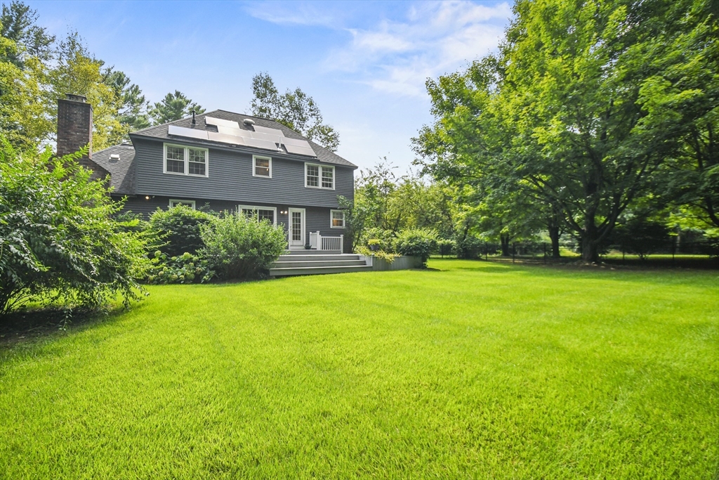 573 Main Street Dunstable, MA 01827 - Photo 33 of 42 a front view of a house with a yard