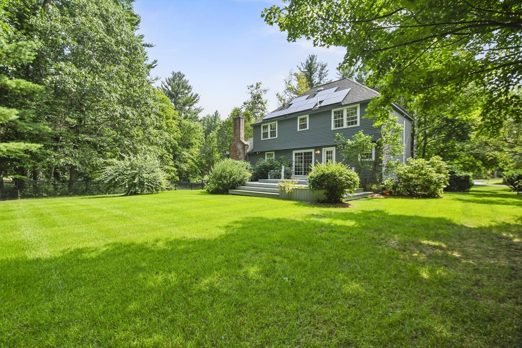 573 Main Street Dunstable, MA 01827 - Photo 34 of 42 a front view of house with garden