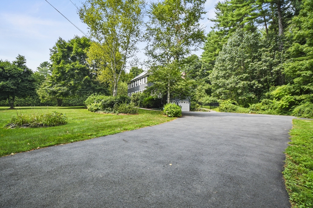 573 Main Street Dunstable, MA 01827 - Photo 36 of 42 a view of a garden with a tree