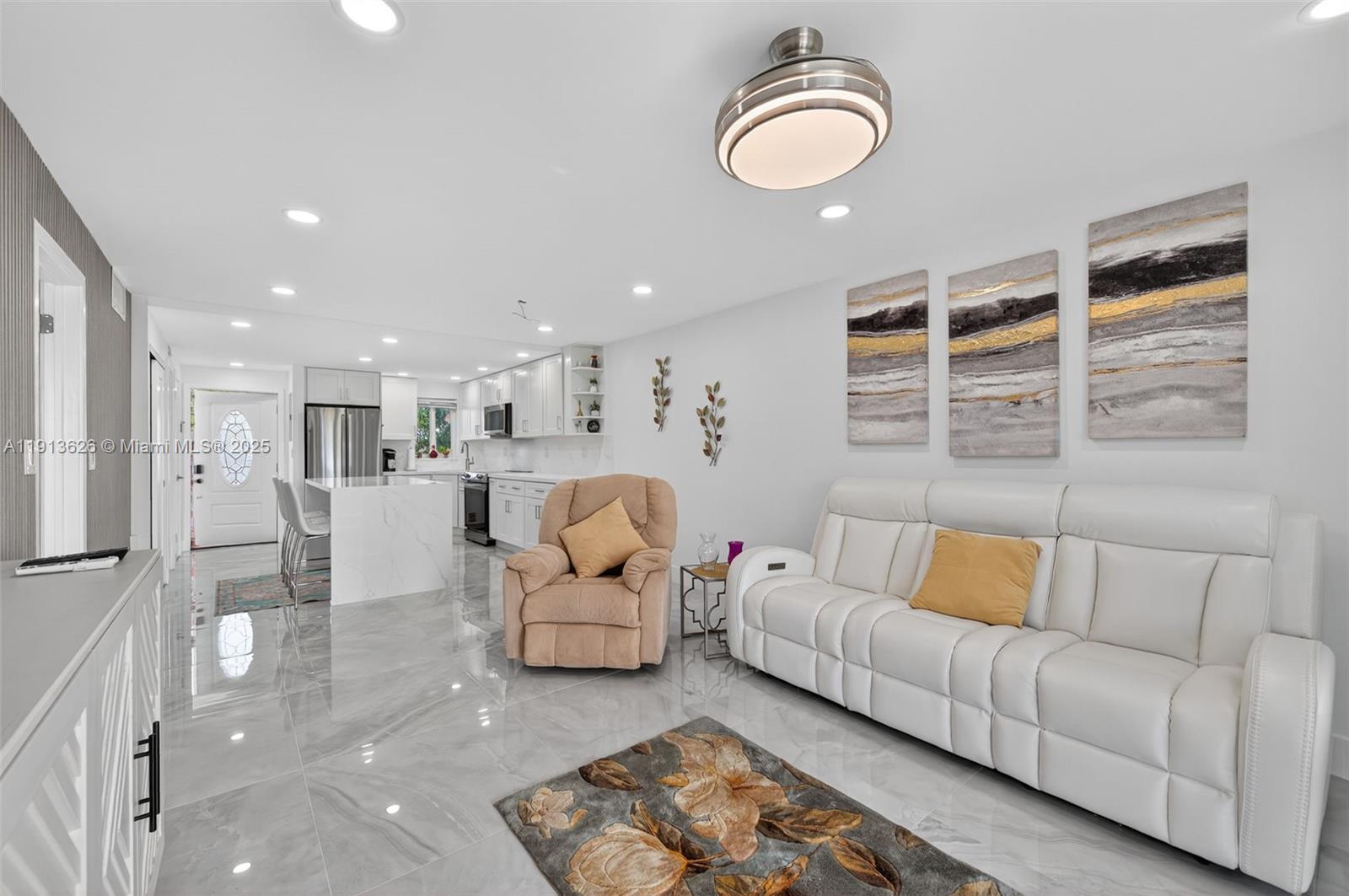 8900 Washington Street, Unit 410 Pembroke Pines, FL 33025 - Photo 12 of 79 a living room with furniture and a large window
