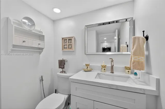 a bedroom with bed and a chandelier