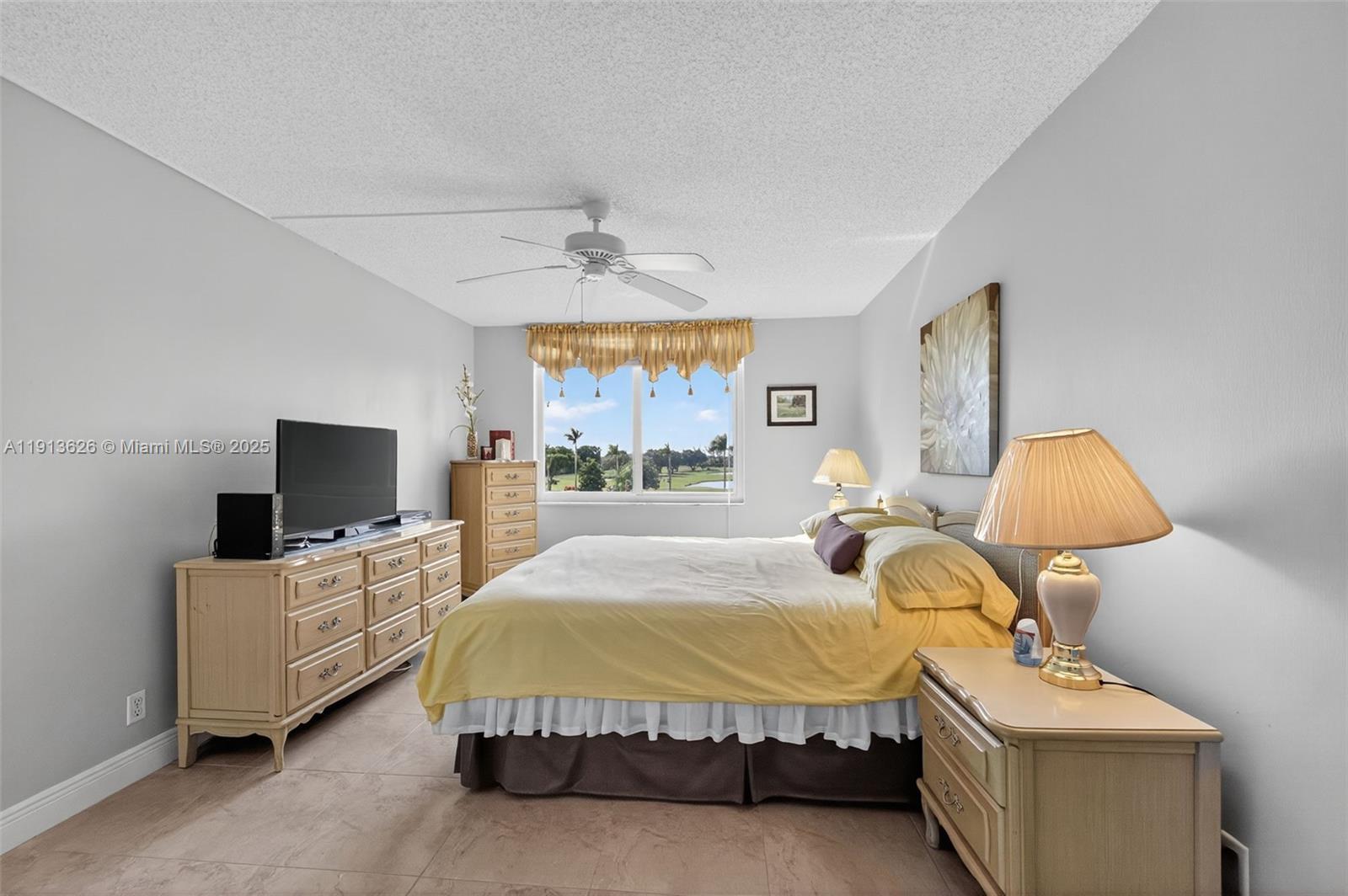 8900 Washington Street, Unit 410 Pembroke Pines, FL 33025 - Photo 17 of 79 a bed room with a bed and a tv