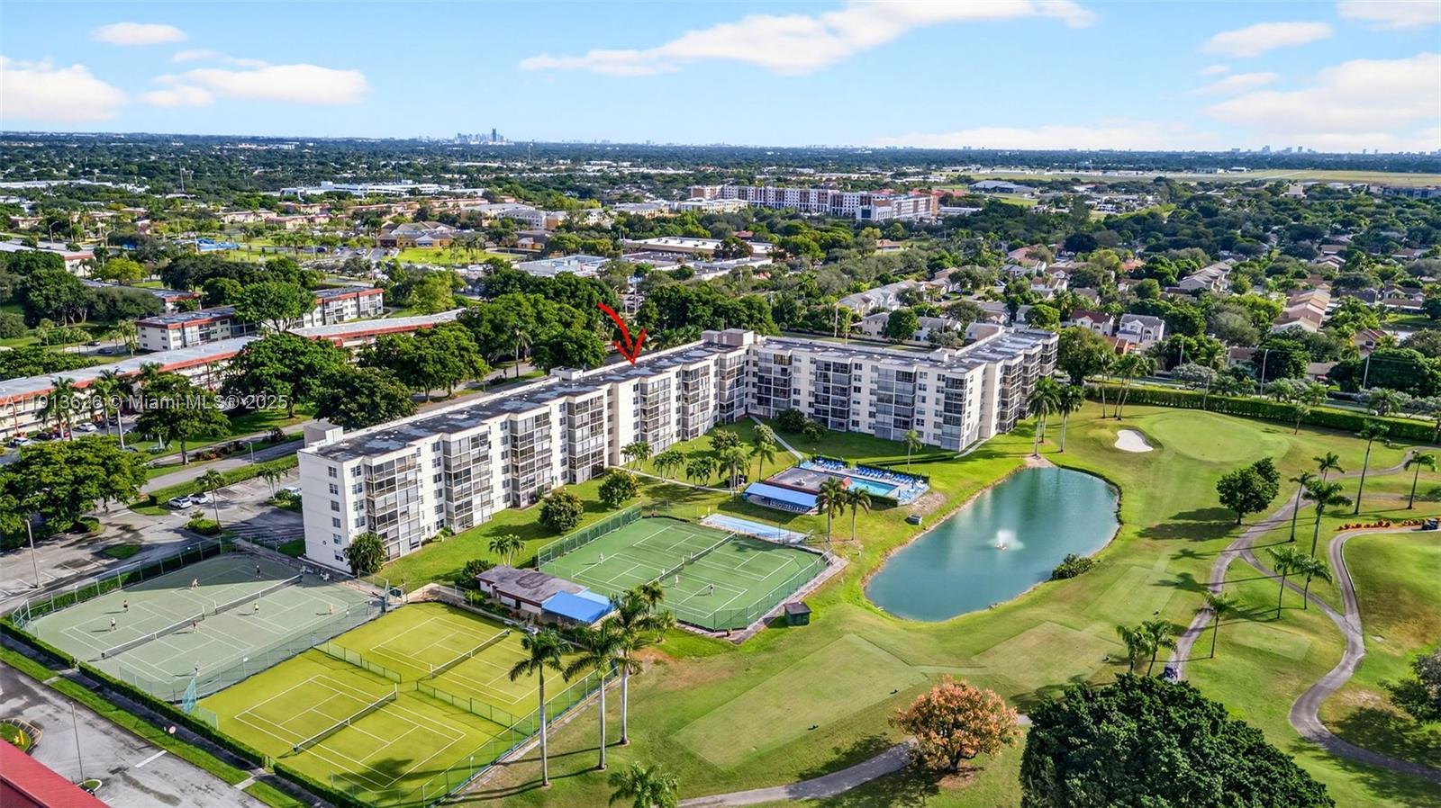 8900 Washington Street, Unit 410 Pembroke Pines, FL 33025 - Photo 2 of 79 an aerial view of a house with a garden and lake view