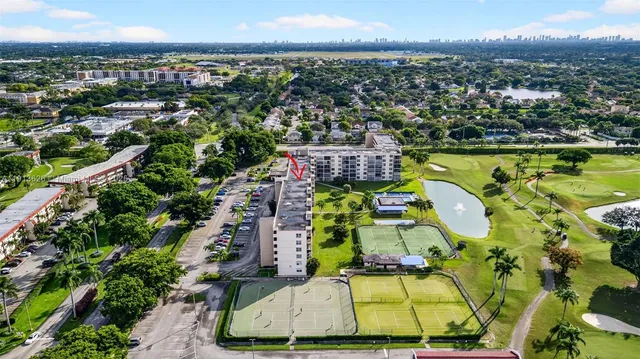 a stove top oven sitting inside of a kitchen
