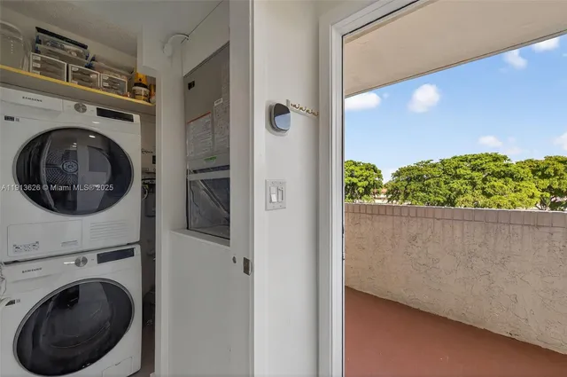 a view of a hallway with washer and dryer