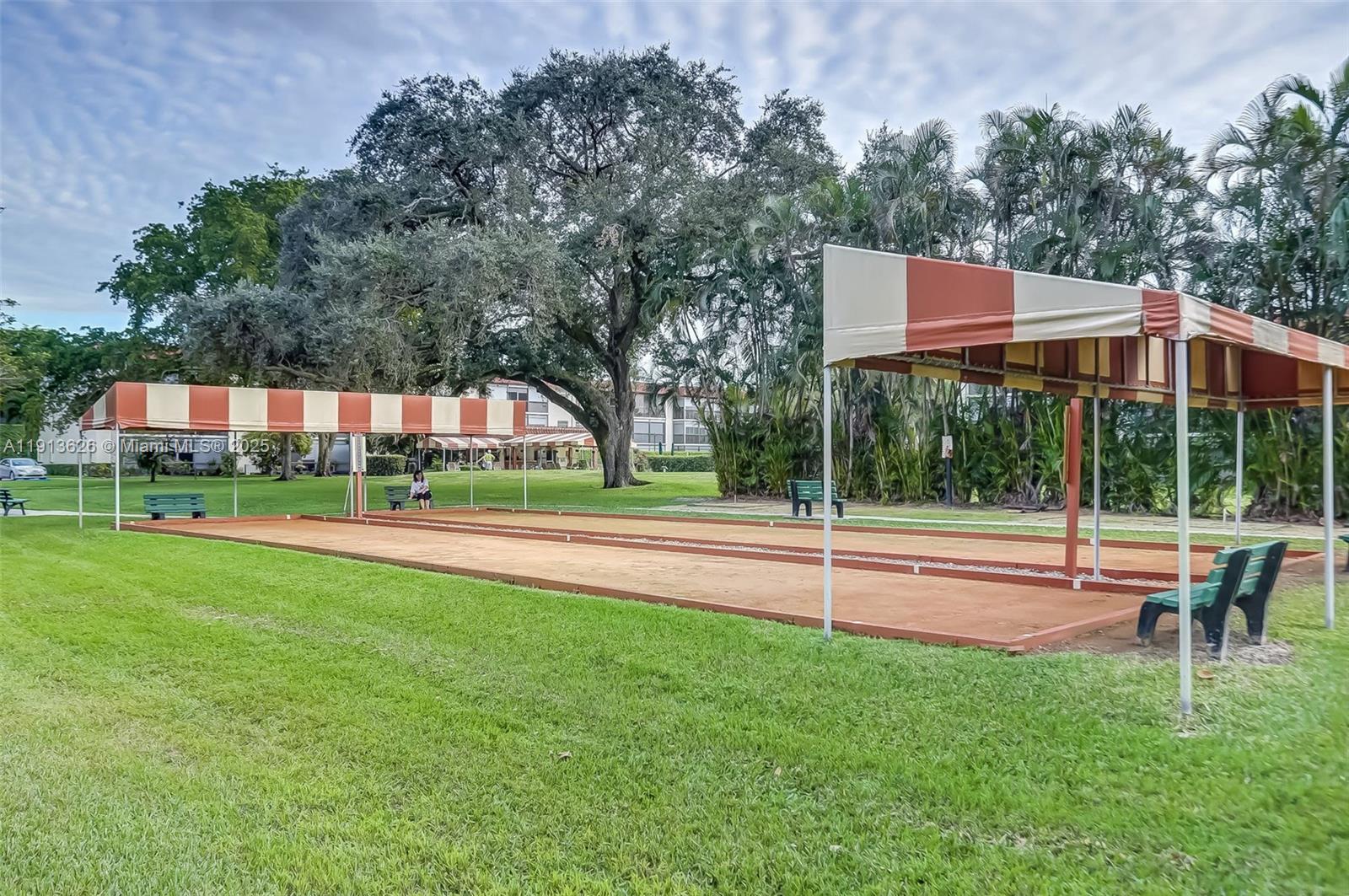 8900 Washington Street, Unit 410 Pembroke Pines, FL 33025 - Photo 36 of 79 a view of an house with backyard and a tree