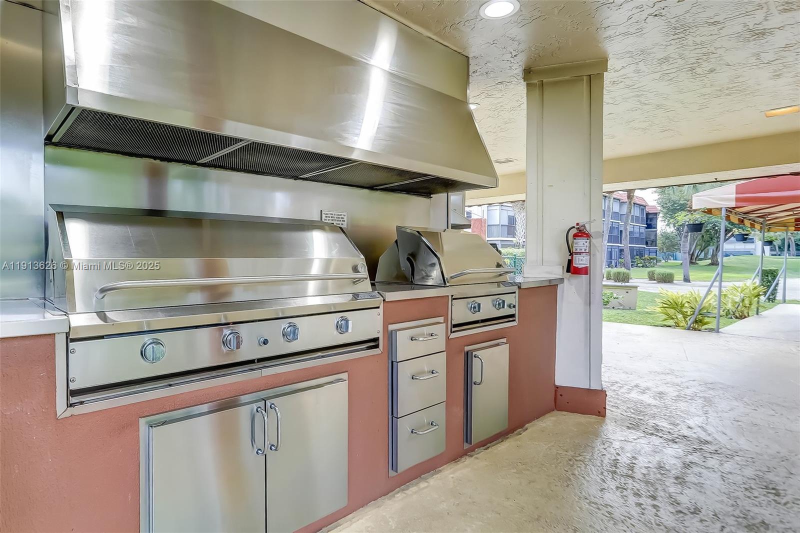 8900 Washington Street, Unit 410 Pembroke Pines, FL 33025 - Photo 37 of 79 a stove top oven sitting inside of a kitchen