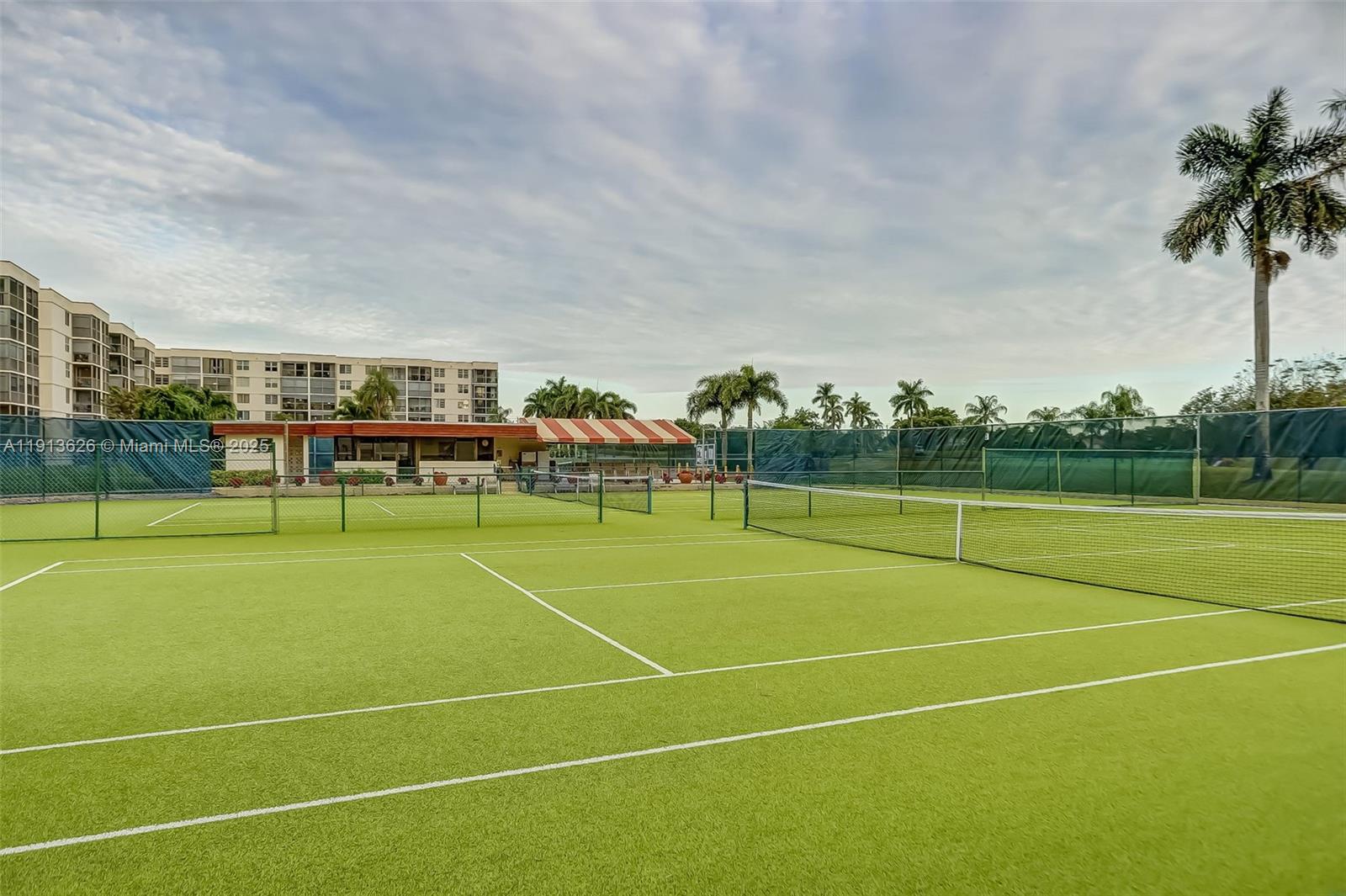 8900 Washington Street, Unit 410 Pembroke Pines, FL 33025 - Photo 42 of 79 a view of an outdoor space and tennis court