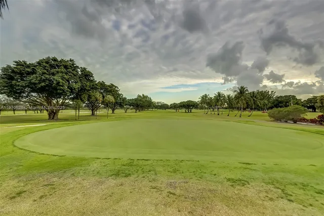 a lobby with a couch and a potted plant