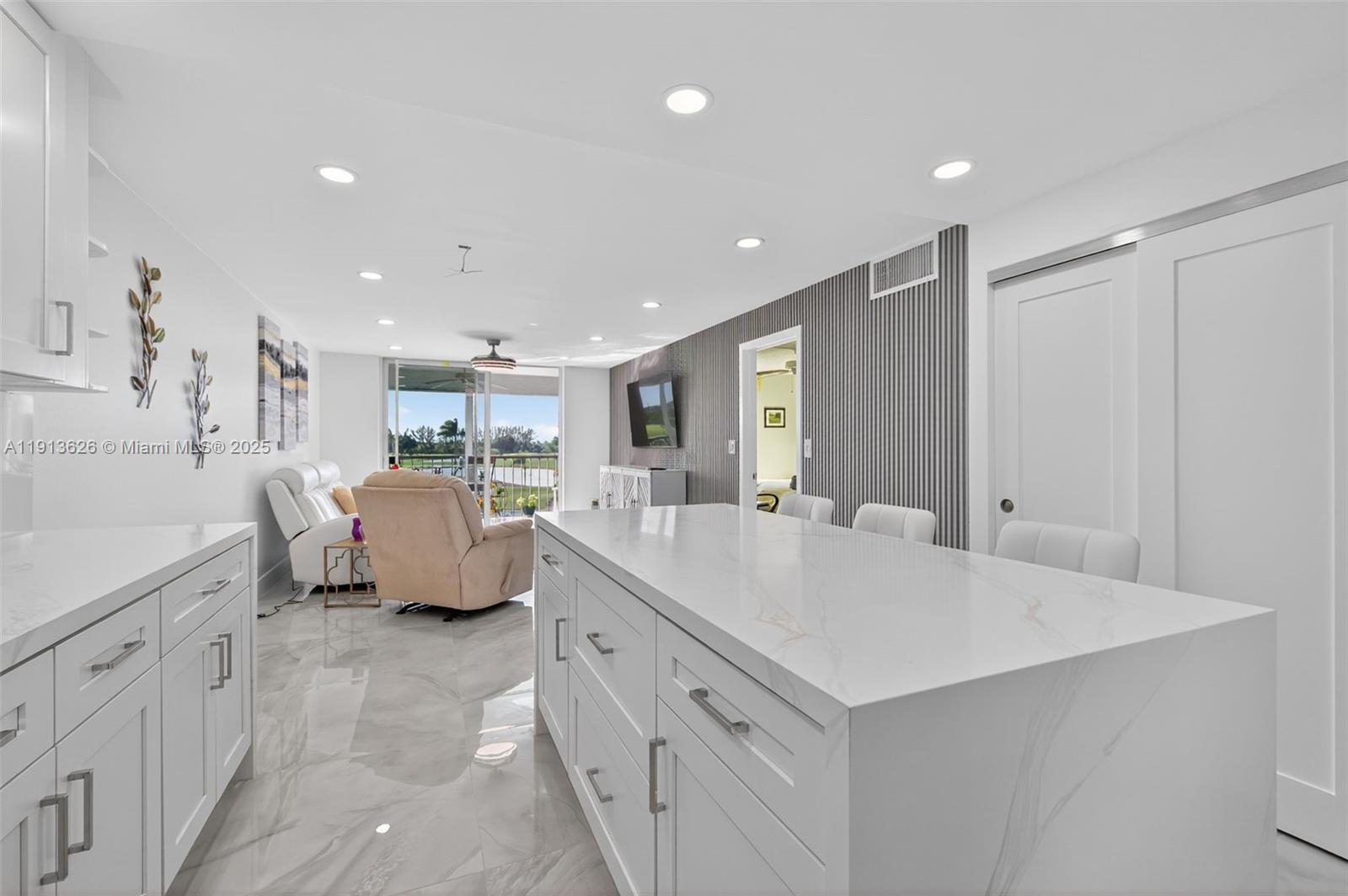 8900 Washington Street, Unit 410 Pembroke Pines, FL 33025 - Photo 5 of 79 a large white room with mirror and shower