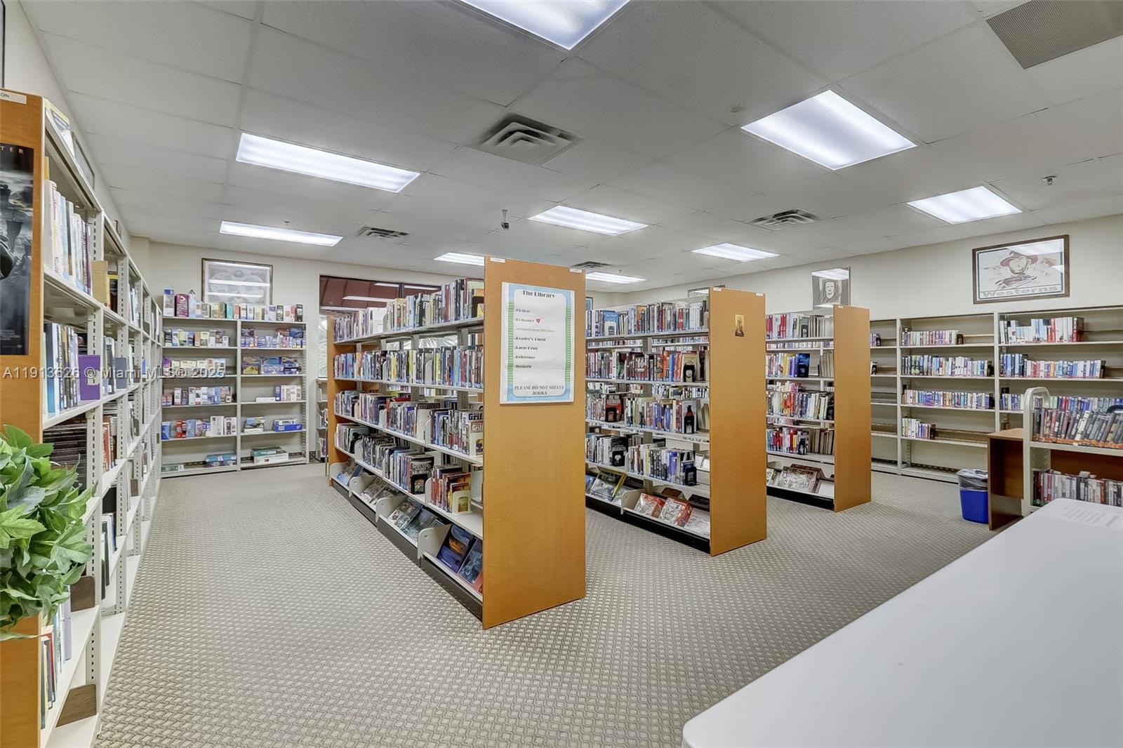 8900 Washington Street, Unit 410 Pembroke Pines, FL 33025 - Photo 58 of 79 a view of walk in closet with clothes and shoes