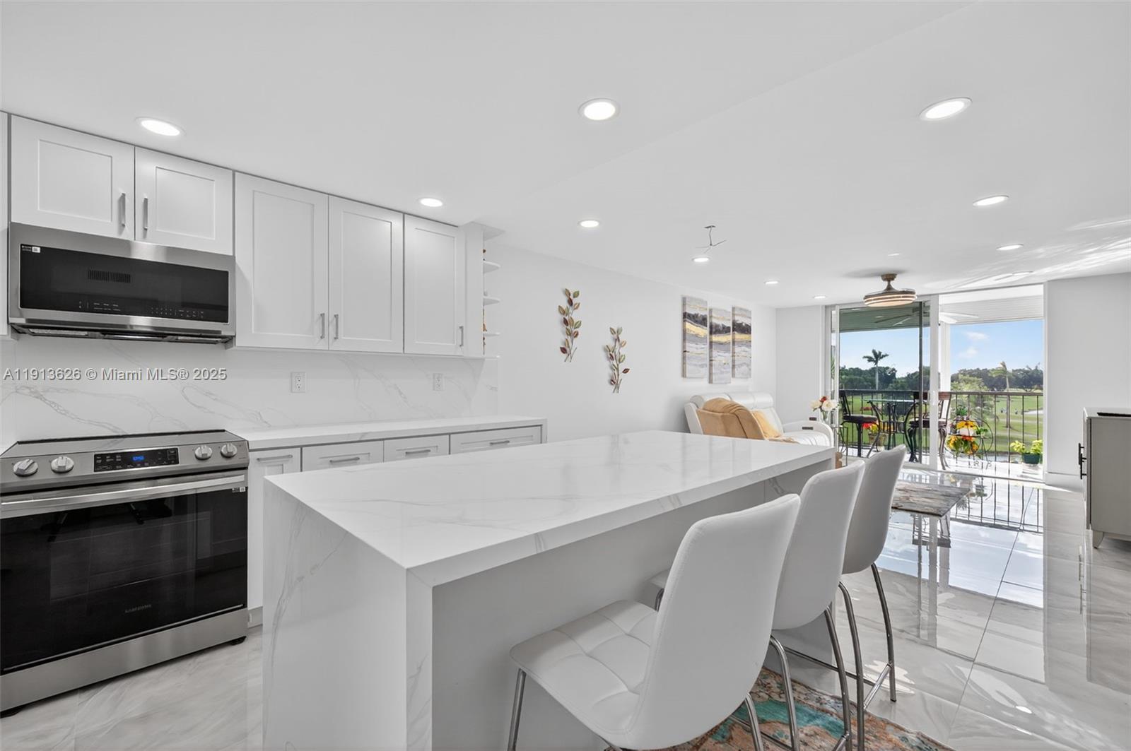 8900 Washington Street, Unit 410 Pembroke Pines, FL 33025 - Photo 7 of 79 a large kitchen with a table and chairs