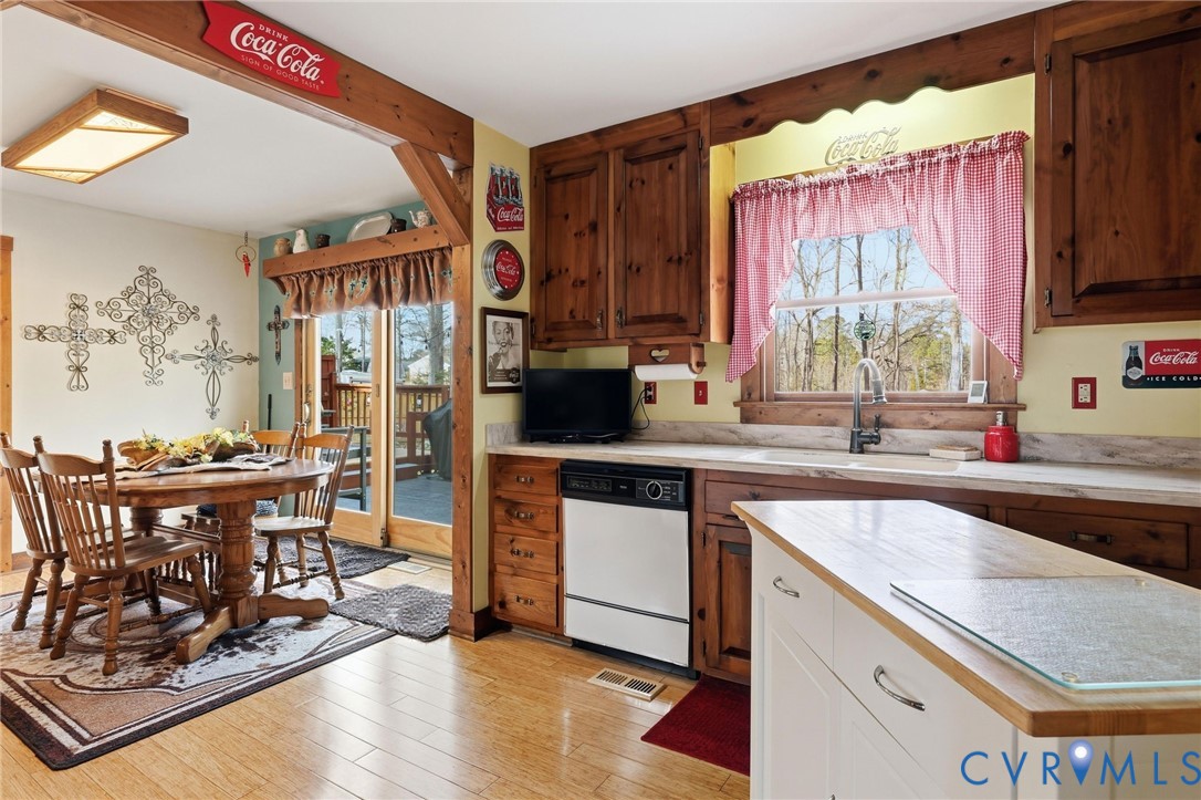 4022 Evelake Road Richmond, VA 23237 - Photo 20 of 35 a kitchen with stainless steel appliances granite countertop a stove a sink and a microwave