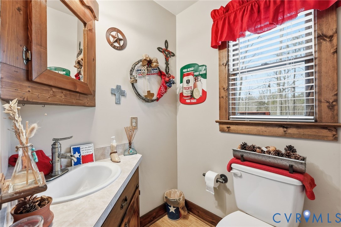 4022 Evelake Road Richmond, VA 23237 - Photo 25 of 35 a bathroom with a sink and a mirror