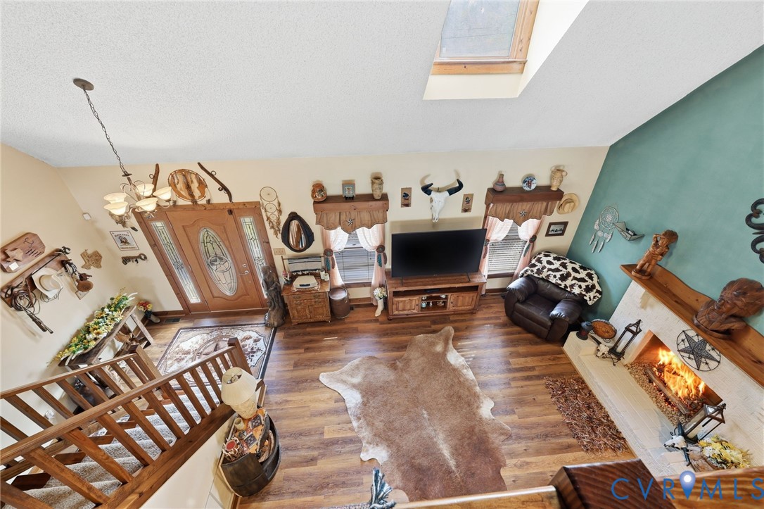 4022 Evelake Road Richmond, VA 23237 - Photo 26 of 35 a living room with furniture and a flat screen tv