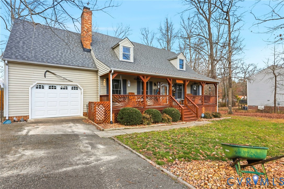 4022 Evelake Road Richmond, VA 23237 - Photo 3 of 35 a view of a house with floor to ceiling windows and yard