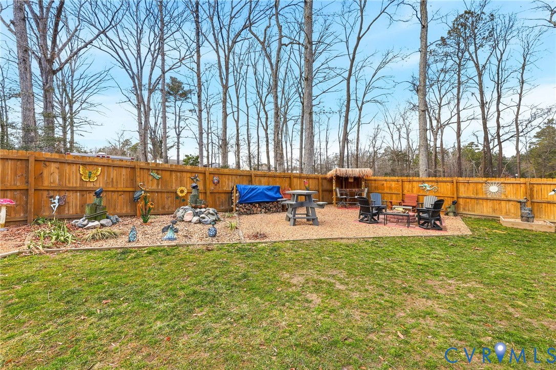 4022 Evelake Road Richmond, VA 23237 - Photo 6 of 35 a view of swimming pool with chairs and table