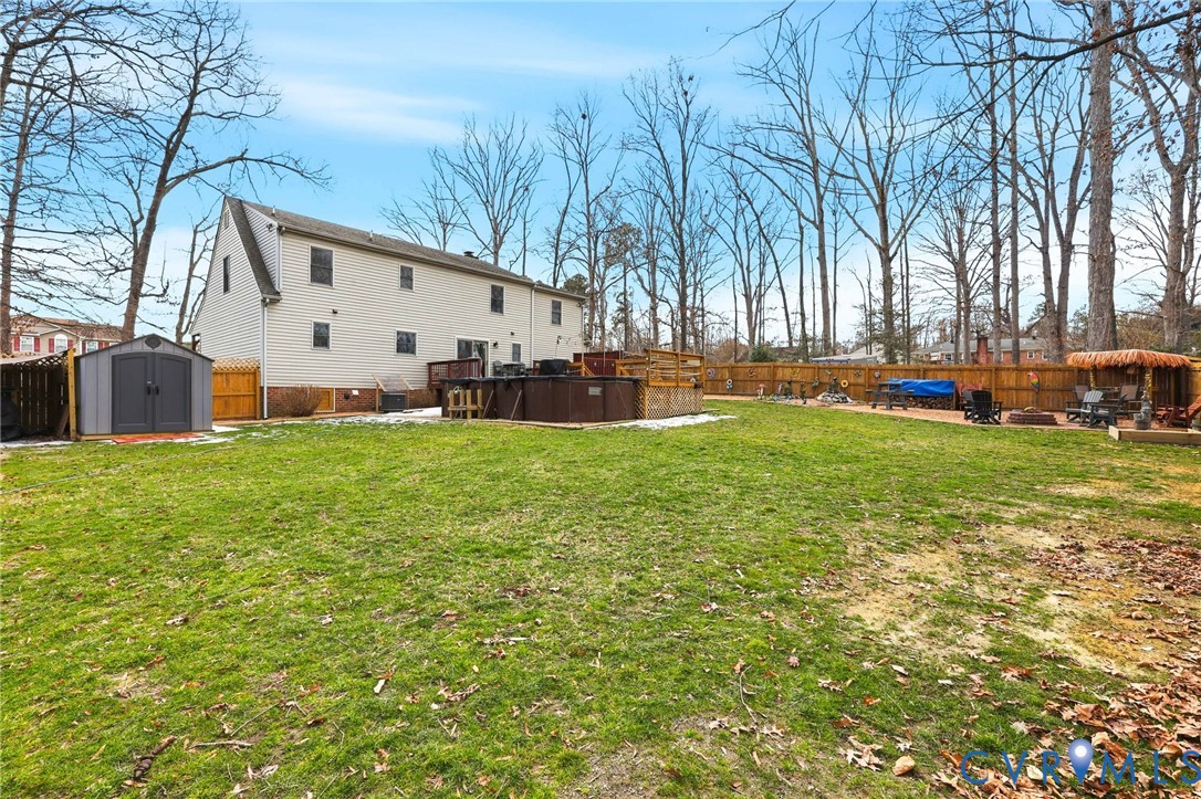 4022 Evelake Road Richmond, VA 23237 - Photo 8 of 35 a view of a house with a yard patio and tree