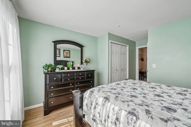 a bedroom with a bed and a dresser