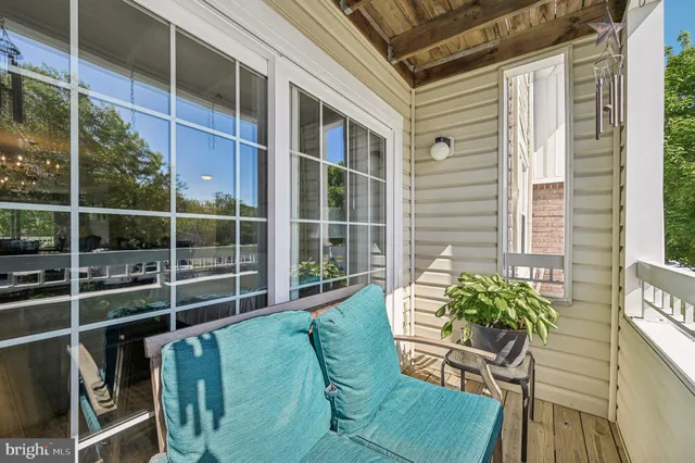 a view of a chair and table in the balcony