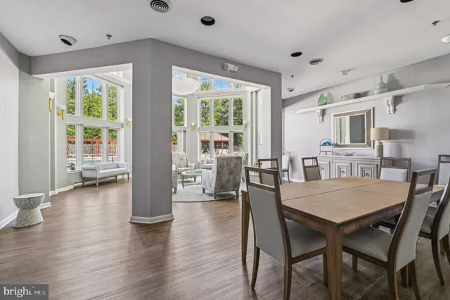 a view of a dining room with furniture and wooden floor