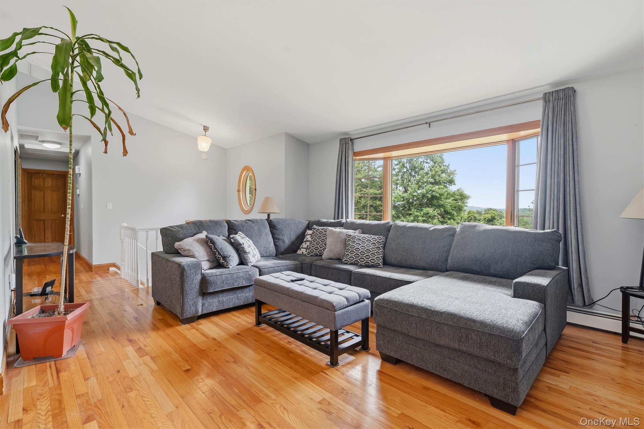 318 Beattie Road Washingtonville, NY 10992 - Photo 9 of 42 a living room with furniture and a window