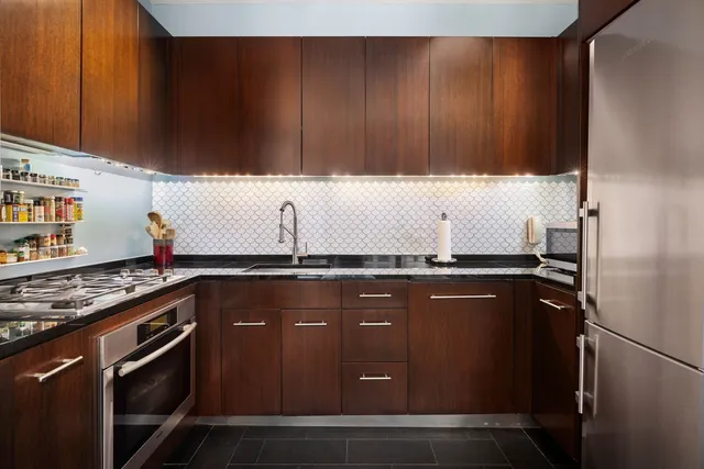 a living room with furniture wooden floor and a flat screen tv