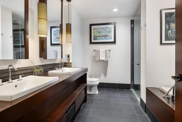 a bedroom with furniture and a large window