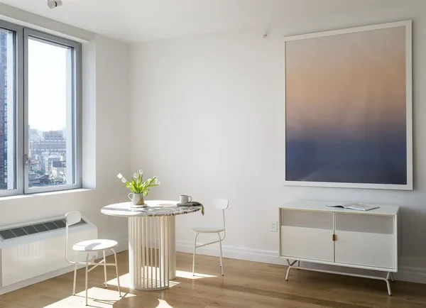 a dining room with furniture and window