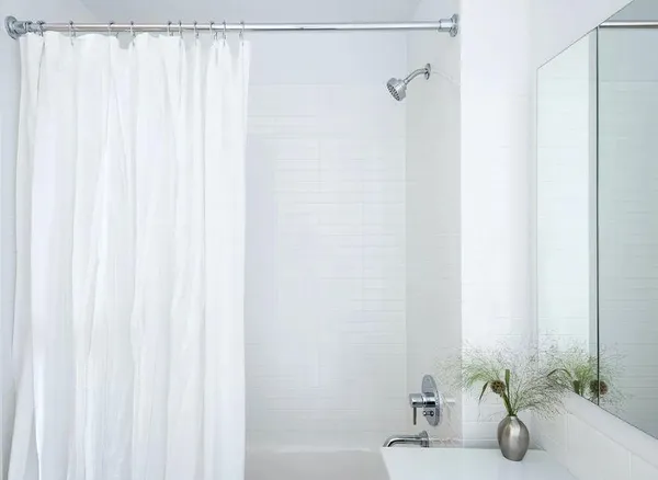 a bathroom with a shower curtain and a sink