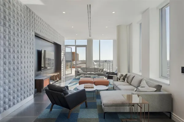 a living room with furniture and a large window