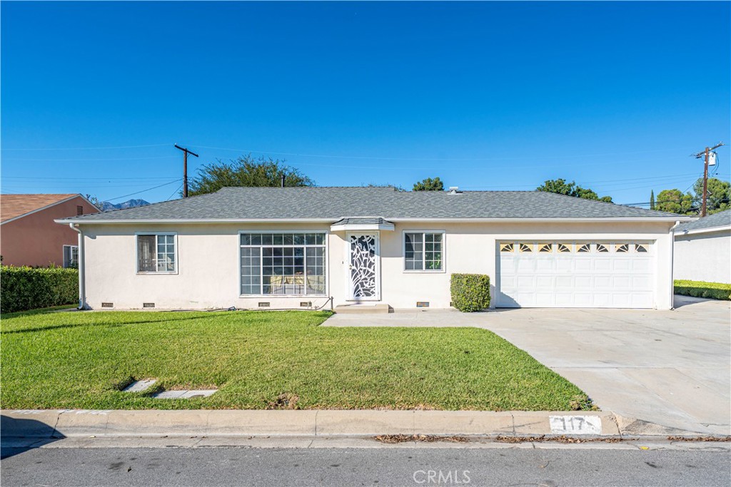 117 Spanner Street Monrovia, CA 91016 - Photo 1 of 33 a front view of a house with a yard and garage